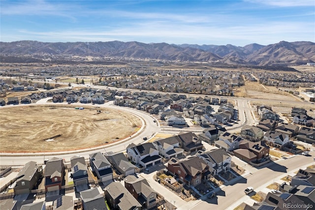 birds eye view of property with a mountain view and a residential view