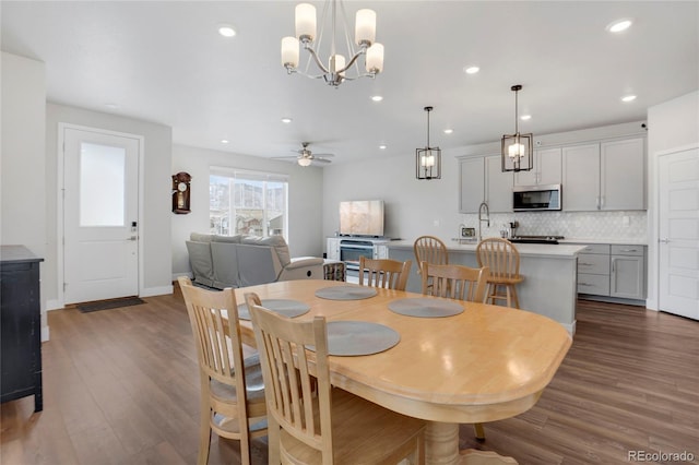 dining area with recessed lighting, ceiling fan, baseboards, and wood finished floors