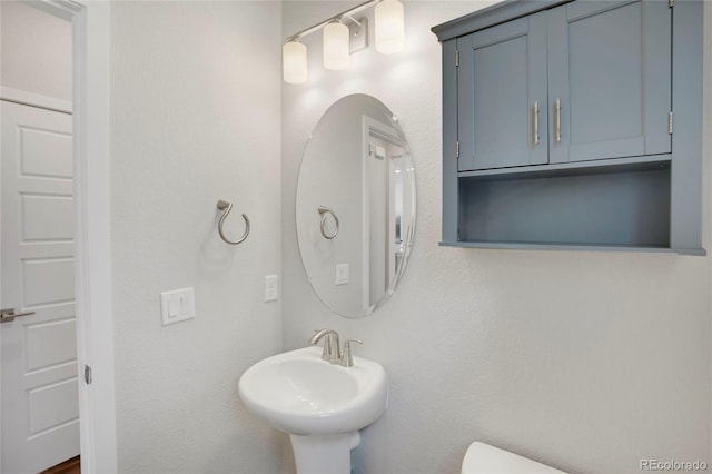 bathroom featuring a sink and toilet