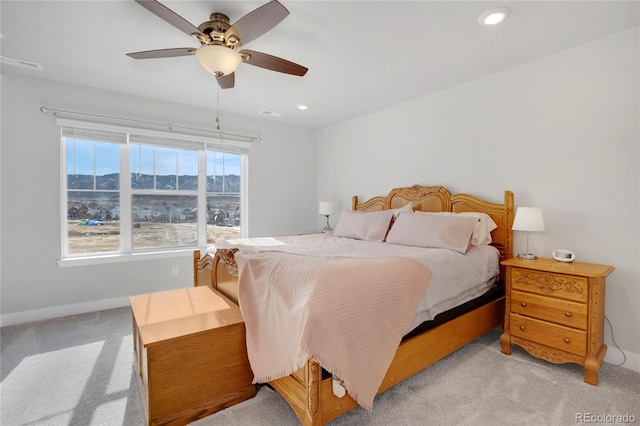 bedroom featuring a mountain view, recessed lighting, light carpet, visible vents, and baseboards