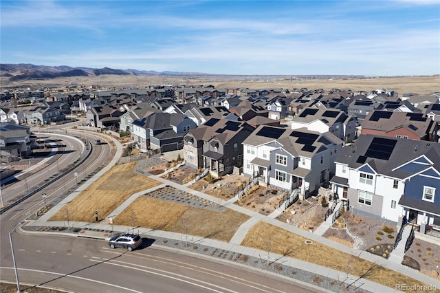 birds eye view of property with a mountain view and a residential view