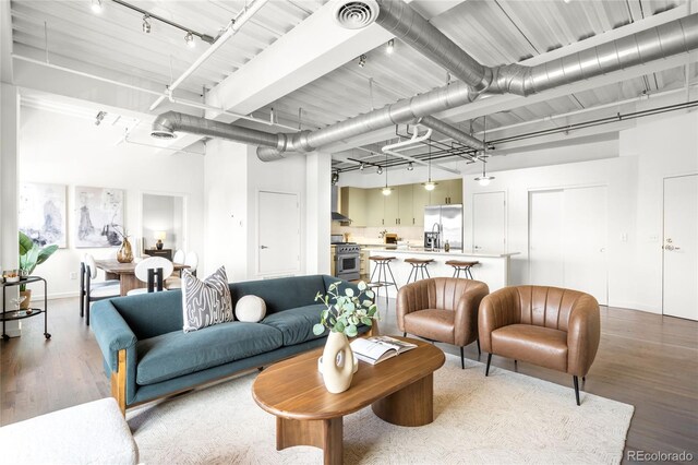 1435 Wazee St Unit 305, Denver, CO 80202 - living area with light wood-style flooring and track lighting