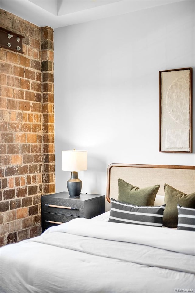 1435 Wazee St Unit 305, Denver, CO 80202 - bedroom featuring brick wall