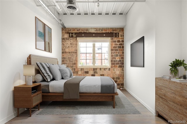 1435 Wazee St Unit 305, Denver, CO 80202 - bedroom with wood finished floors and baseboards