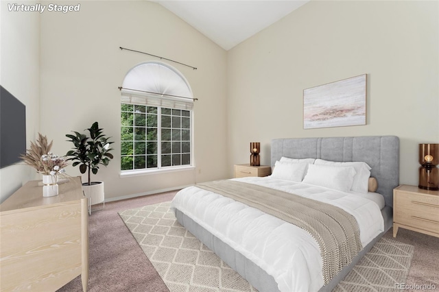 bedroom featuring carpet floors and high vaulted ceiling