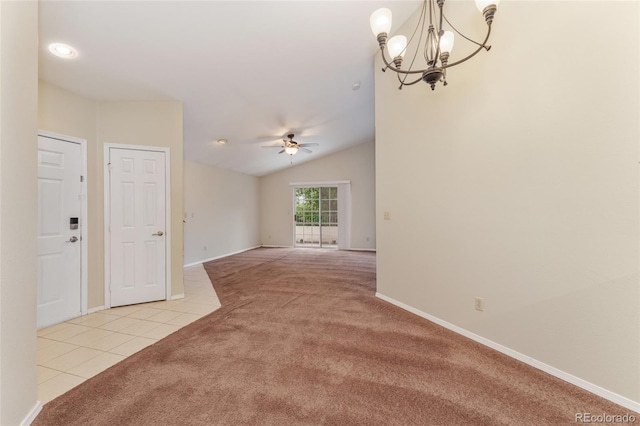 spare room with light carpet, ceiling fan with notable chandelier, and lofted ceiling