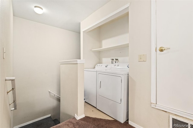 washroom with independent washer and dryer