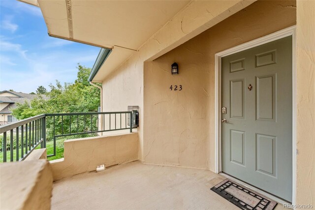 property entrance with a balcony