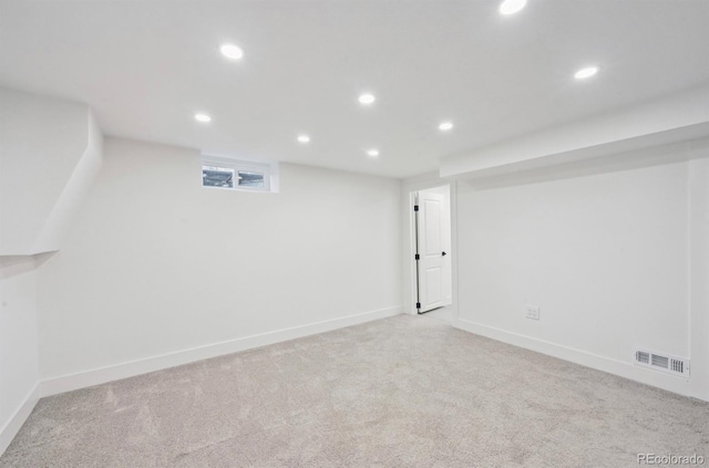 basement featuring recessed lighting, visible vents, baseboards, and carpet flooring