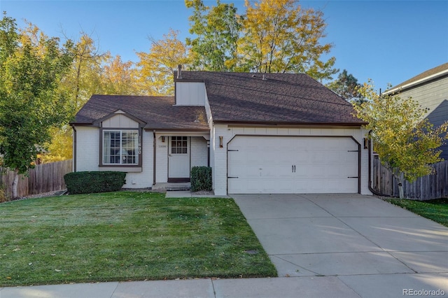 view of front of house featuring a garage and a front yard