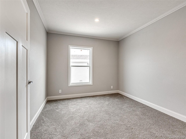 empty room featuring ornamental molding, a textured ceiling, and carpet flooring