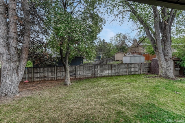 17390 E Greenwood Cir, Aurora, CO 80013 - view of yard featuring a storage shed and an outbuilding