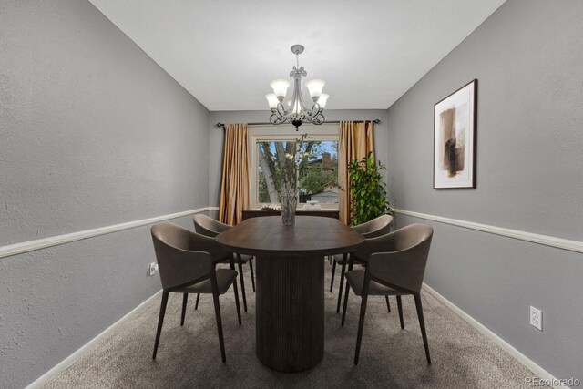 17390 E Greenwood Cir, Aurora, CO 80013 - carpeted dining space featuring a textured wall, a chandelier, and baseboards