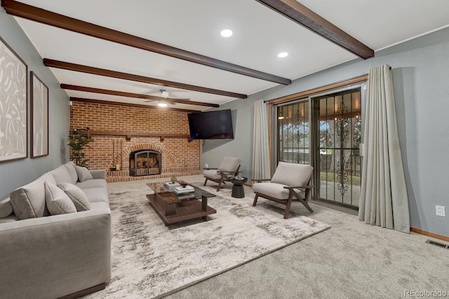 17390 E Greenwood Cir, Aurora, CO 80013 - living area featuring brick wall, beamed ceiling, ceiling fan, carpet, and a fireplace