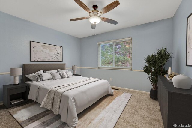 17390 E Greenwood Cir, Aurora, CO 80013 - carpeted bedroom with baseboards and a ceiling fan