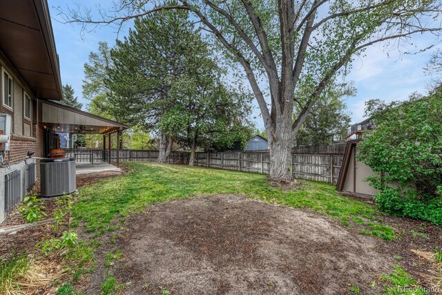 17390 E Greenwood Cir, Aurora, CO 80013 - view of yard featuring central air condition unit and a patio area