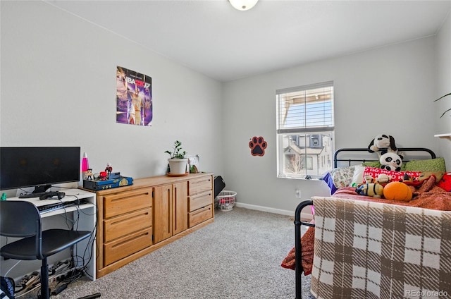 bedroom featuring carpet flooring and baseboards