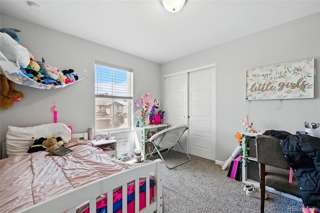 bedroom with carpet and a closet