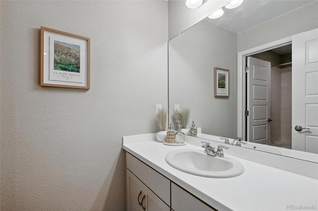 full bath with vanity and walk in shower