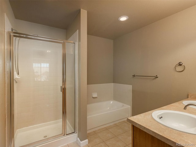 bathroom featuring tile patterned flooring, vanity, and independent shower and bath