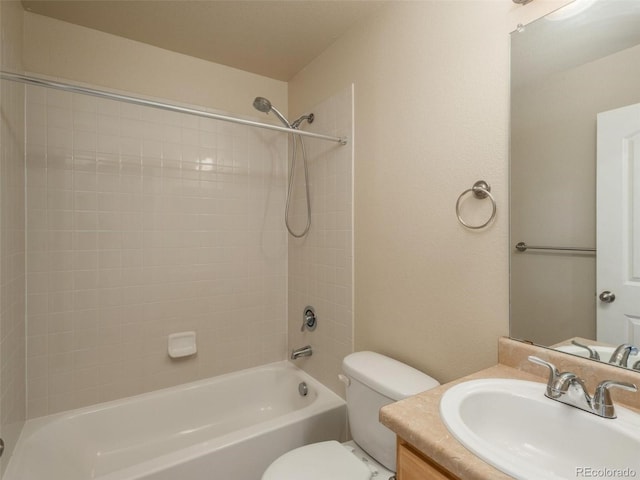 full bathroom featuring vanity, bathtub / shower combination, and toilet