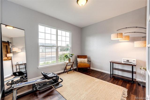 22026 Hill Gail Way, Parker, CO 80138 - sitting room featuring wood finished floors, an office area, and baseboards