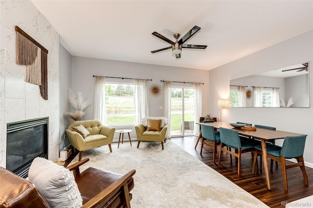 22026 Hill Gail Way, Parker, CO 80138 - living room featuring a ceiling fan, wood finished floors, and a premium fireplace