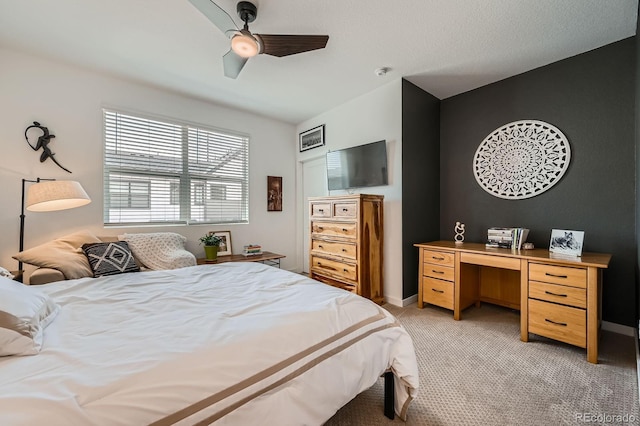 bedroom featuring a ceiling fan, baseboards, and light colored carpet