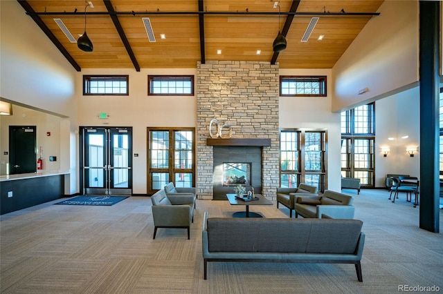 living room with carpet, wood ceiling, french doors, and high vaulted ceiling