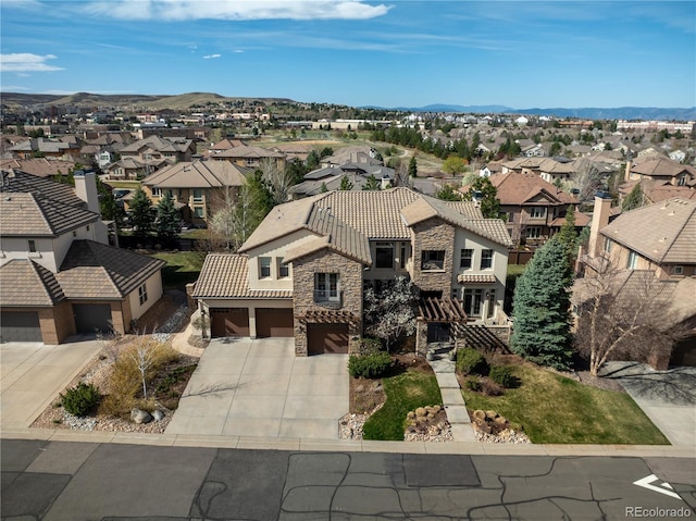 birds eye view of property featuring a mountain view and a residential view