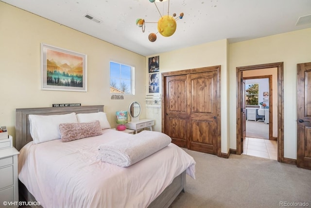 bedroom with light colored carpet, baseboards, multiple windows, and visible vents