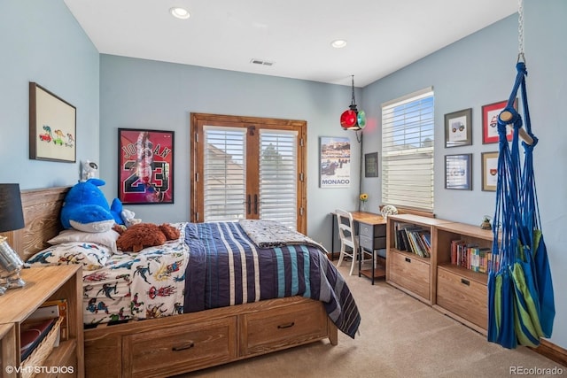 bedroom featuring recessed lighting, visible vents, and light carpet