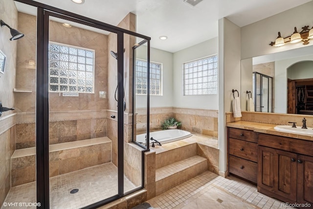 full bathroom with a shower stall, a garden tub, tile patterned floors, vanity, and recessed lighting