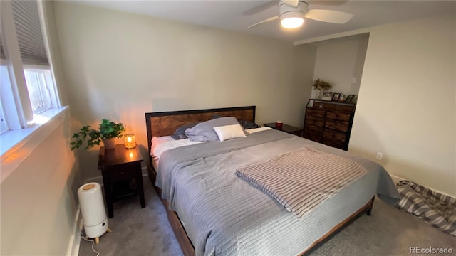 carpeted bedroom with a ceiling fan