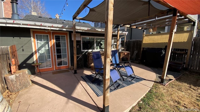 view of patio / terrace with french doors and fence