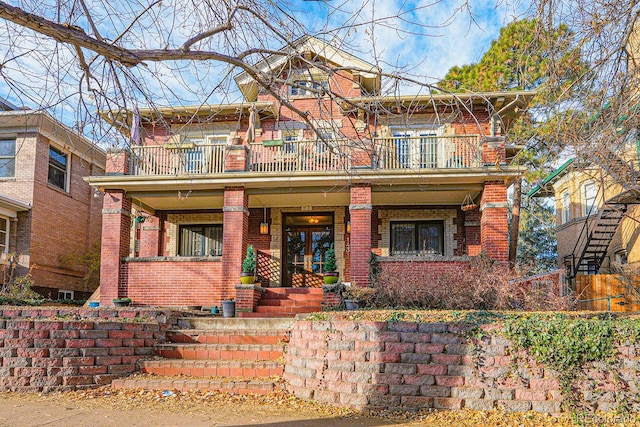 view of front of house featuring a porch and a balcony