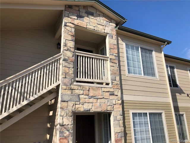 view of property exterior with stone siding