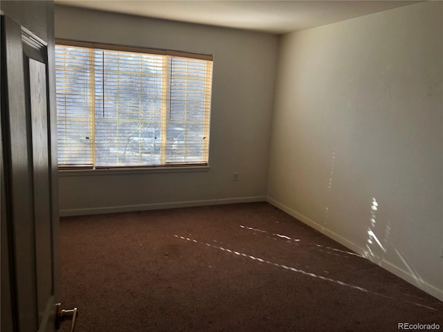 empty room with baseboards