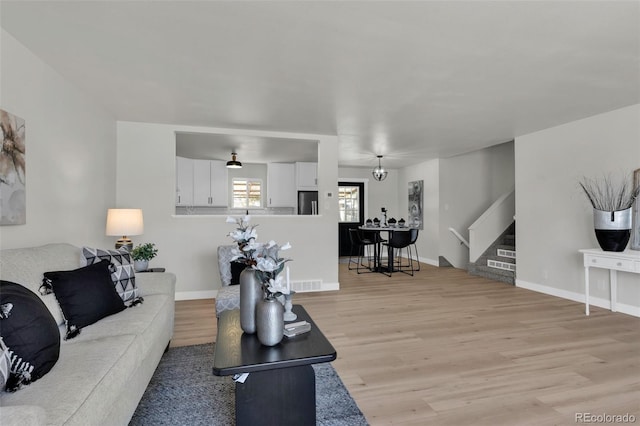 living room with light hardwood / wood-style floors