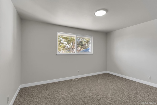 unfurnished room with carpet flooring