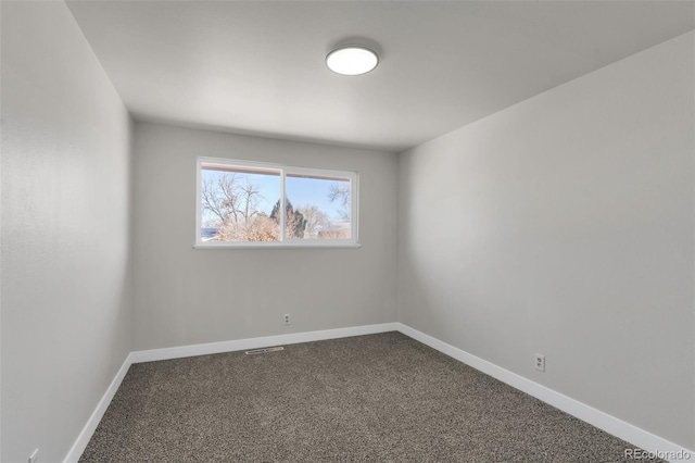 spare room featuring carpet floors