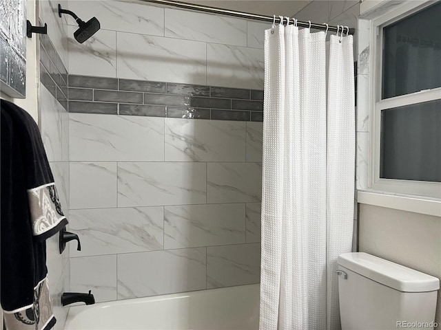 bathroom with shower / bathtub combination with curtain and toilet