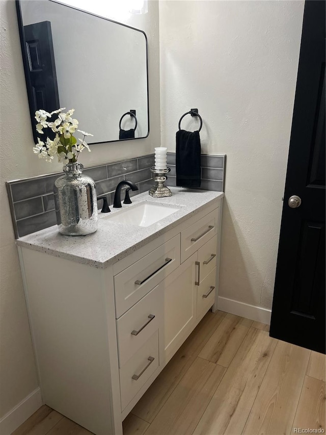 bathroom with wood-type flooring and vanity