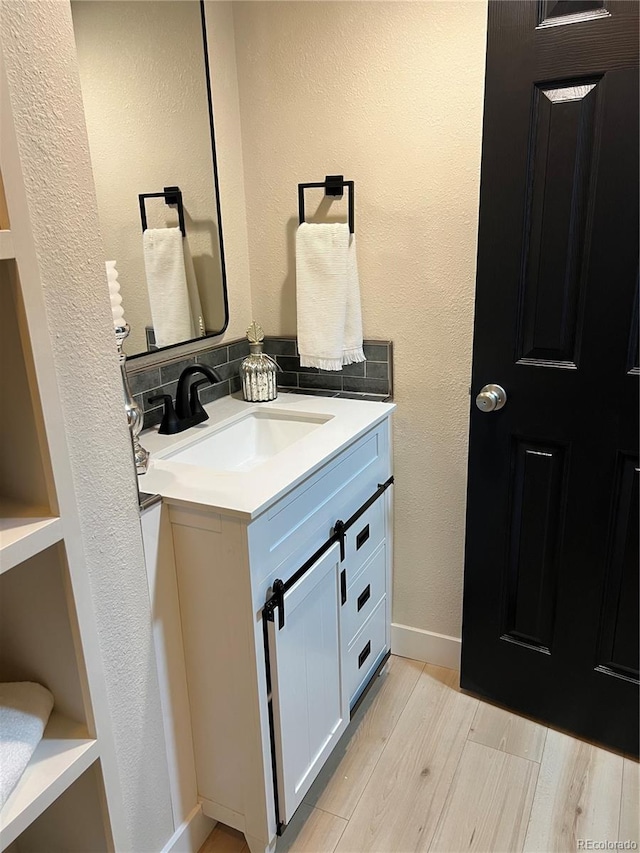 bathroom featuring vanity and wood-type flooring