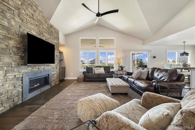living room featuring a ceiling fan, dark wood-style floors, a fireplace, and high vaulted ceiling