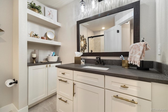 full bathroom with vanity and a shower stall