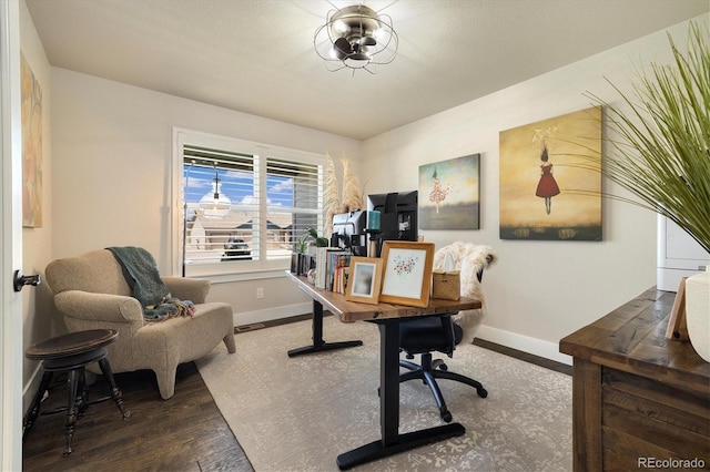 office space featuring wood finished floors and baseboards
