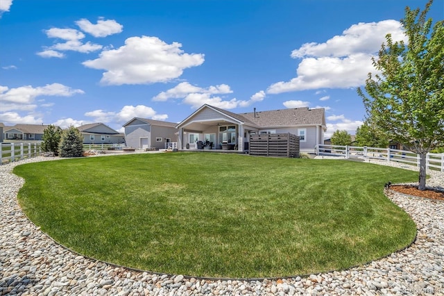 rear view of property featuring a patio area
