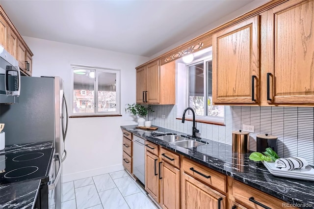 kitchen with black range with electric stovetop, dishwasher, sink, dark stone countertops, and decorative backsplash