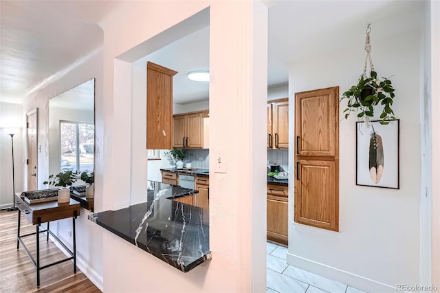 kitchen featuring tasteful backsplash and light tile patterned floors